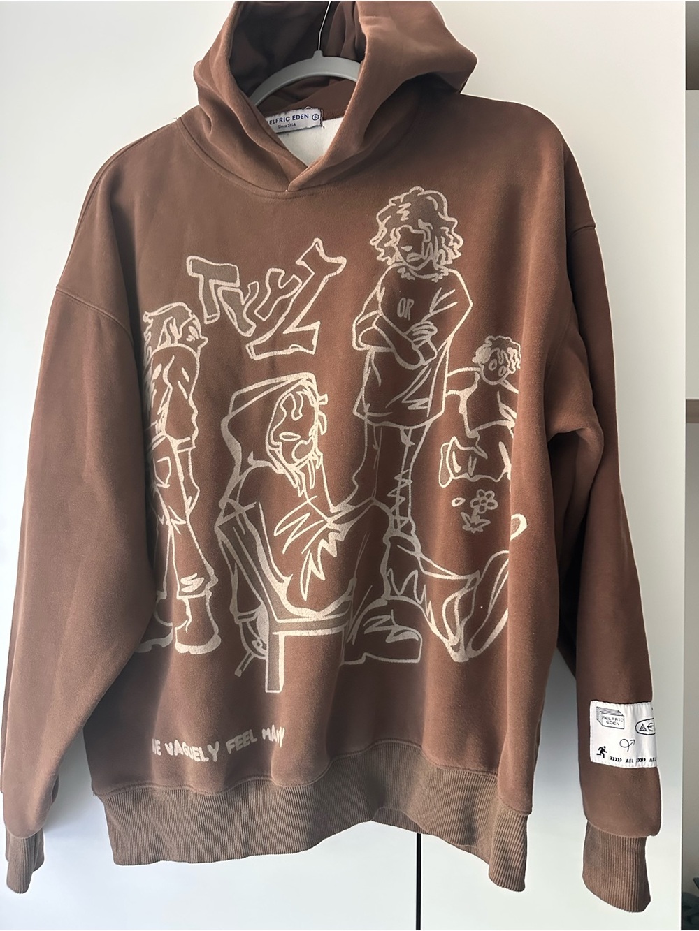 Brown Graphic Hoodie with Cream Sketch Design Aelfric Eden S graphic